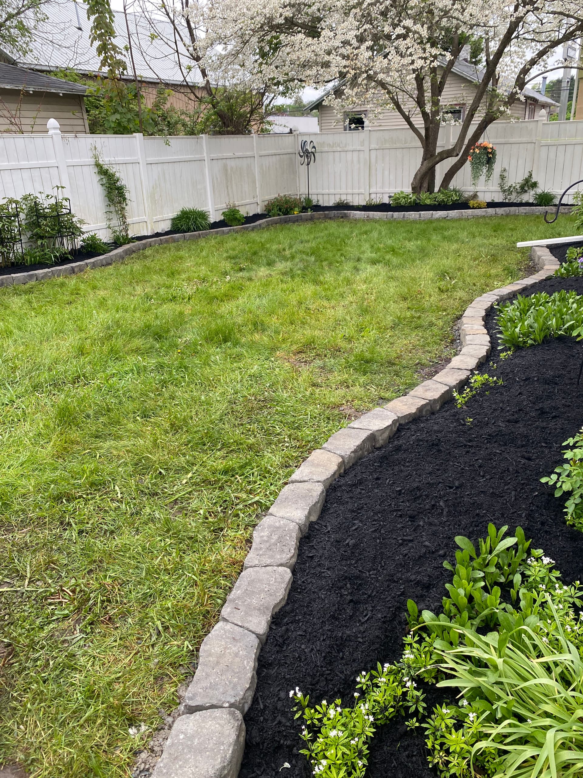 Stone Garden Wall and Mulch Bed Installation Done Right image