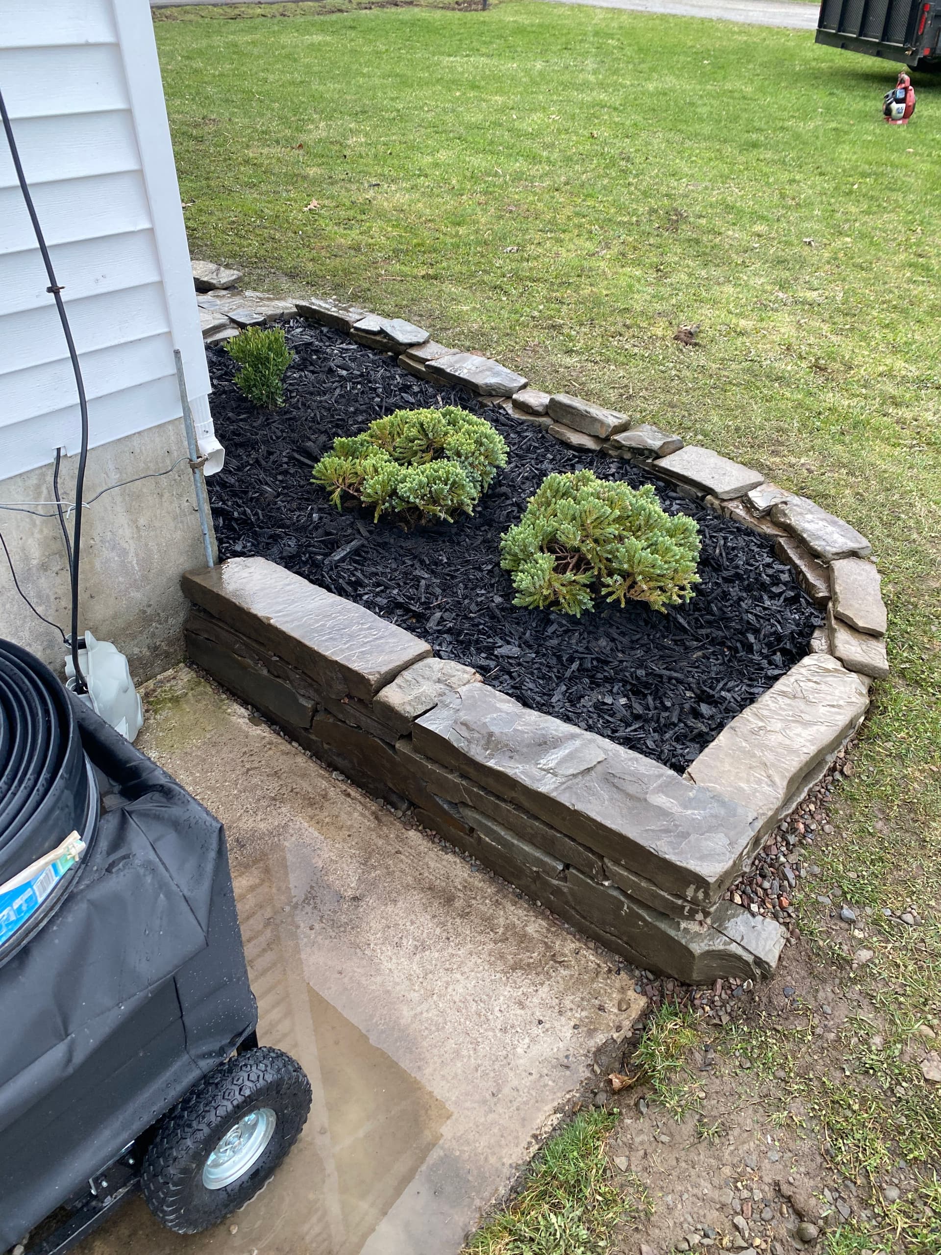 Gallery photos for Local Stone Retaining Wall with Mulch Beds and Shrub Install: Image #1