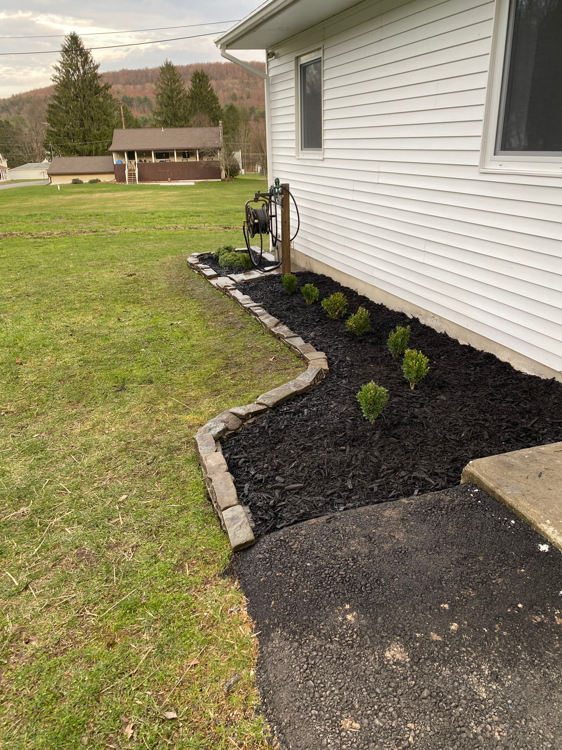 Gallery photos for Local Stone Retaining Wall with Mulch Beds and Shrub Install: Image #2