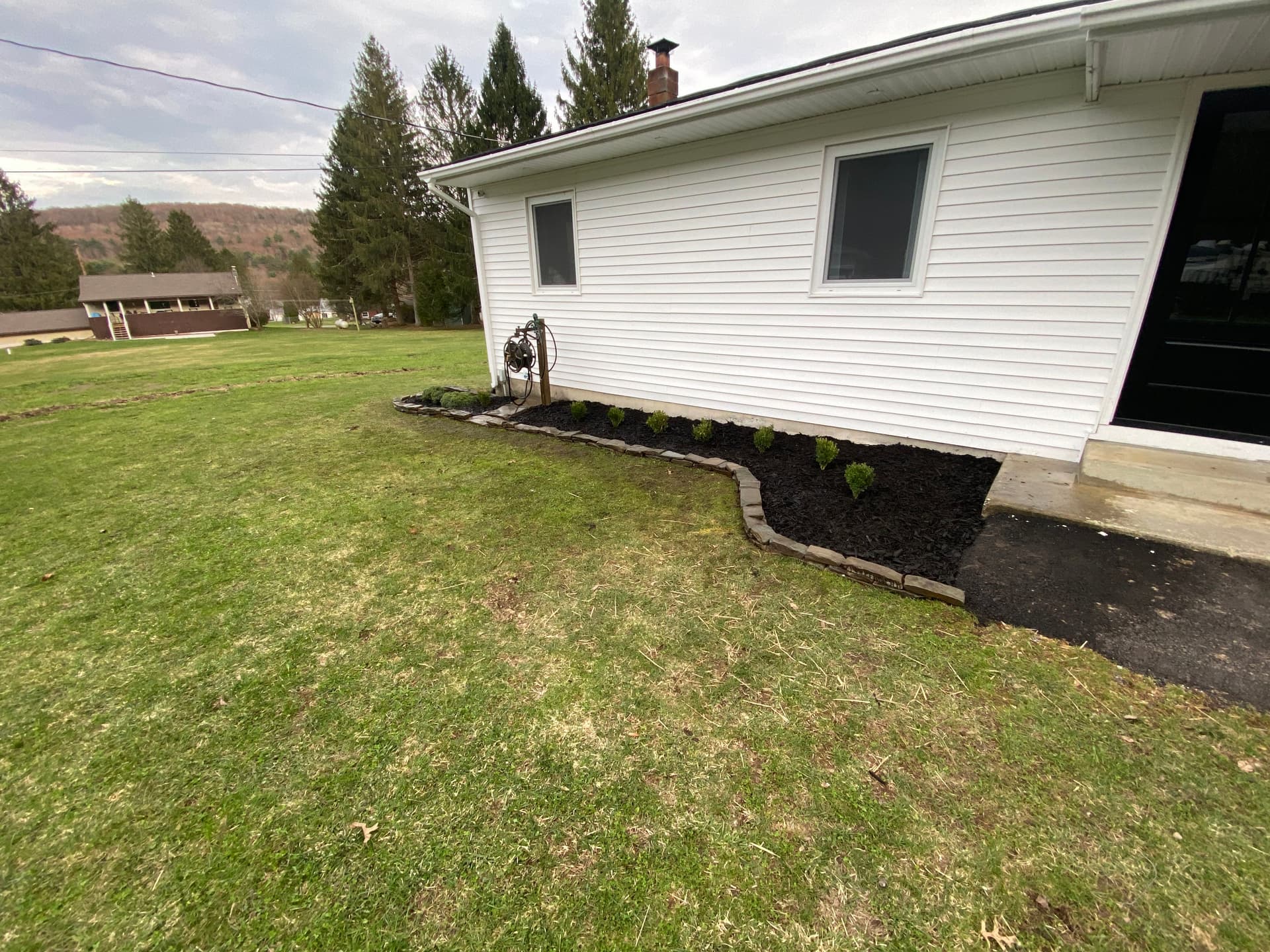 Gallery photos for Local Stone Retaining Wall with Mulch Beds and Shrub Install: Image #3
